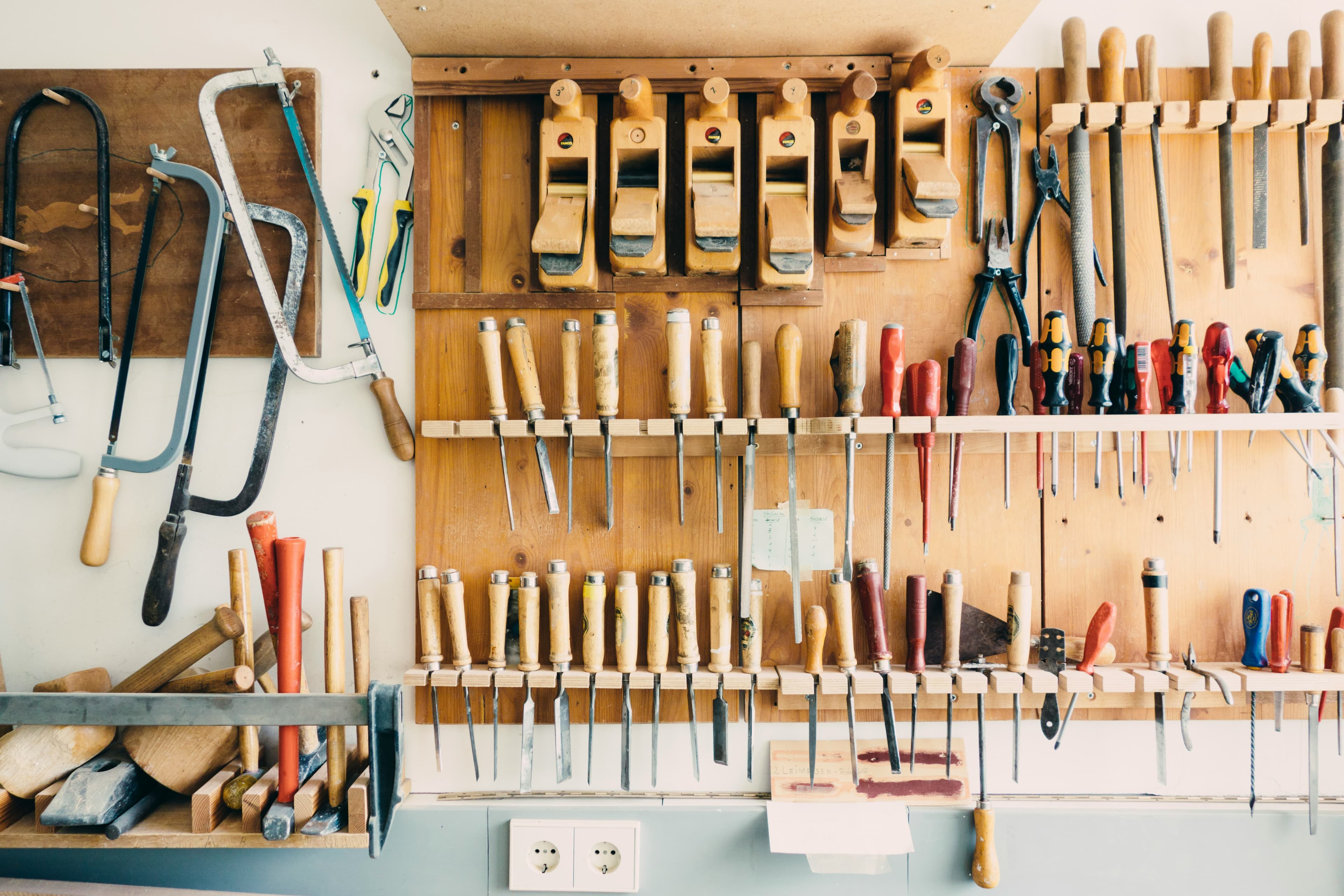 A workshop wall with each tool in its designated holder.